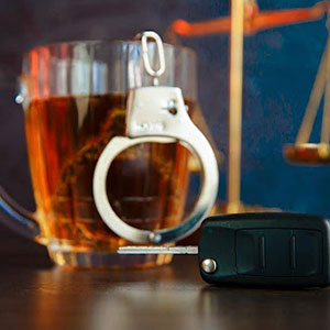 A car key and a glass of beer - The Law Office Of Michael D. Barber