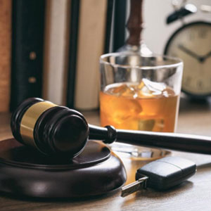 A gavel, wine glass and car keys - The Law Office Of Michael D. Barber